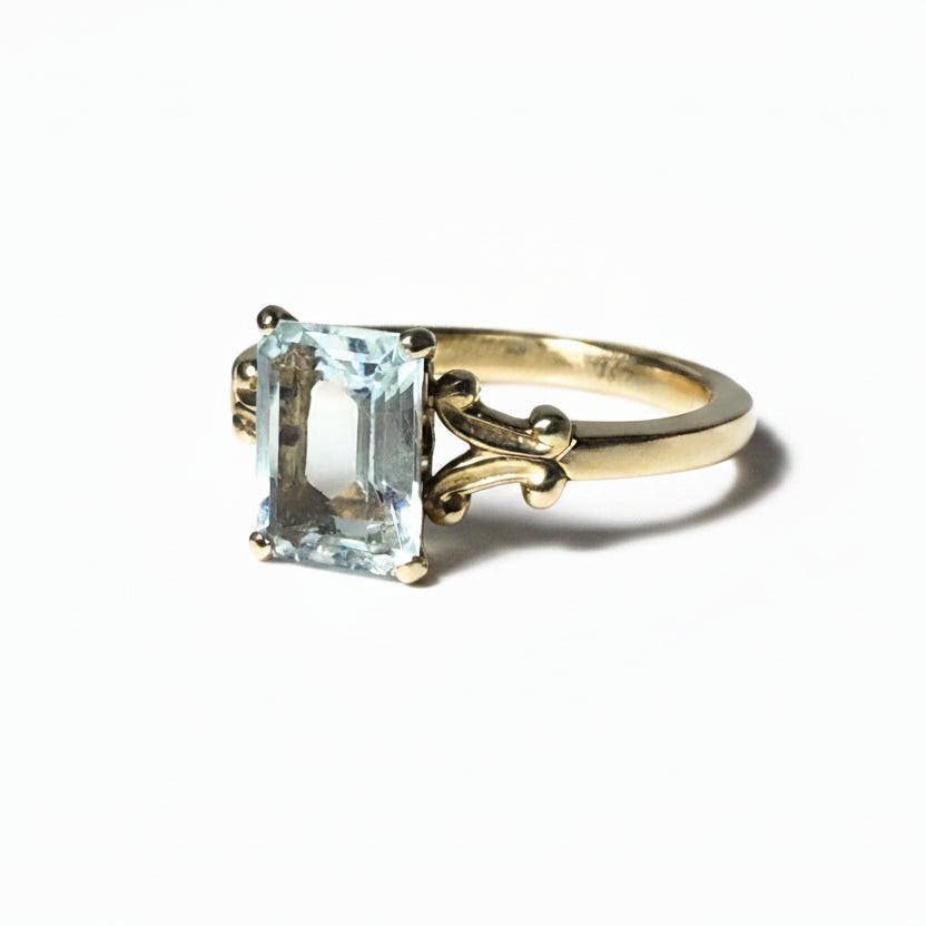 ring, gold ring, aquamarine ring, solitaire ring, aquamarine solitaire, split shank, gold and aquamarine, jewelry, 14k gold, 14k gold ring, yellow gold, emerald cut, emerald cut aquamarine, emerald cut solitaire, emerald cut ring, rebekah brooks jewelry, northampton, cambridge
