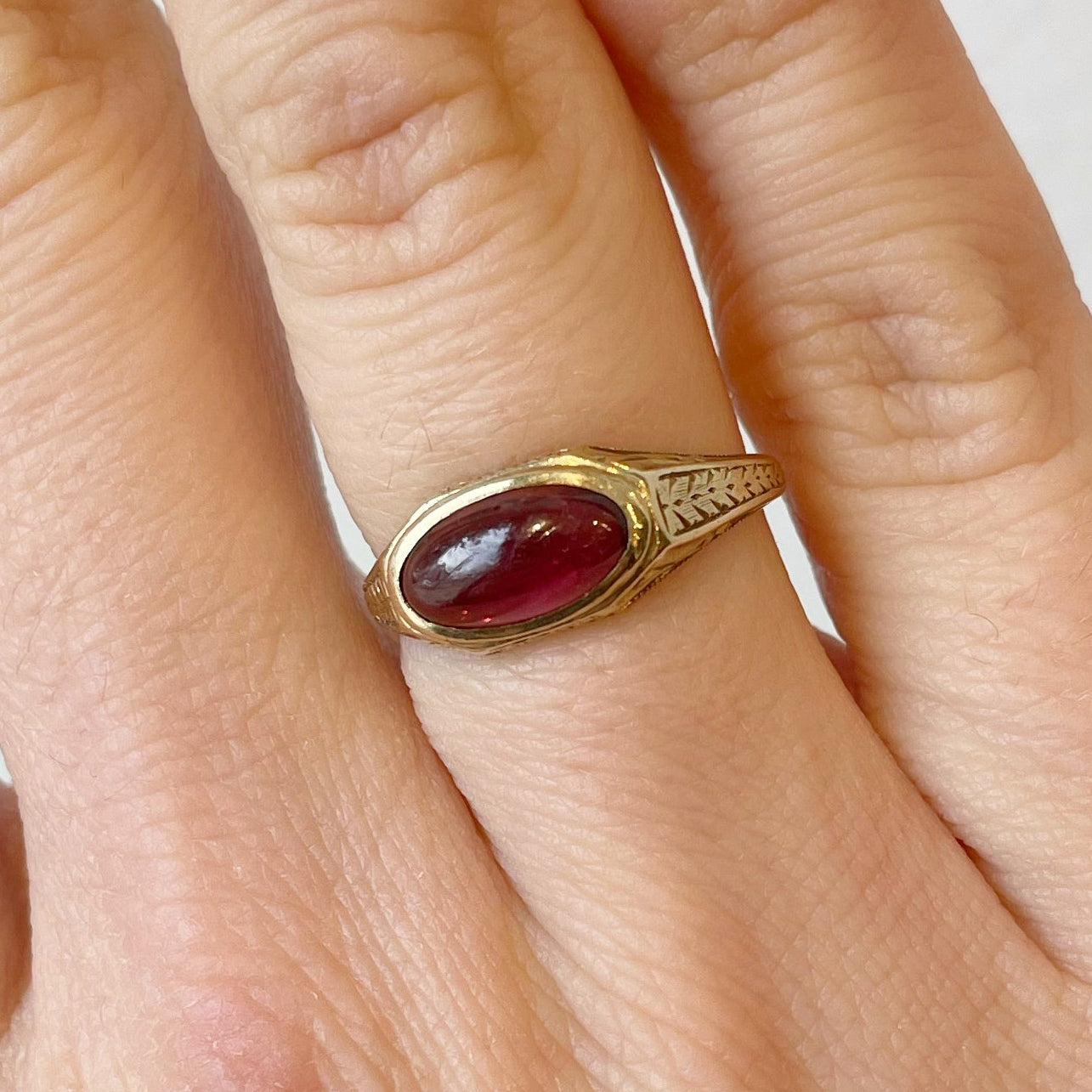 Ring, Antique Ring, Garnet ring, antique garnet ring, east west ring, east west setting, oval ring, oval garnet, oval solitaire, engraved, engraved ring, victorian ring, antique jewelry, cocktail ring, statement ring, engagement ring, fashion ring, bezel setting, bezel ring, gemstone ring
