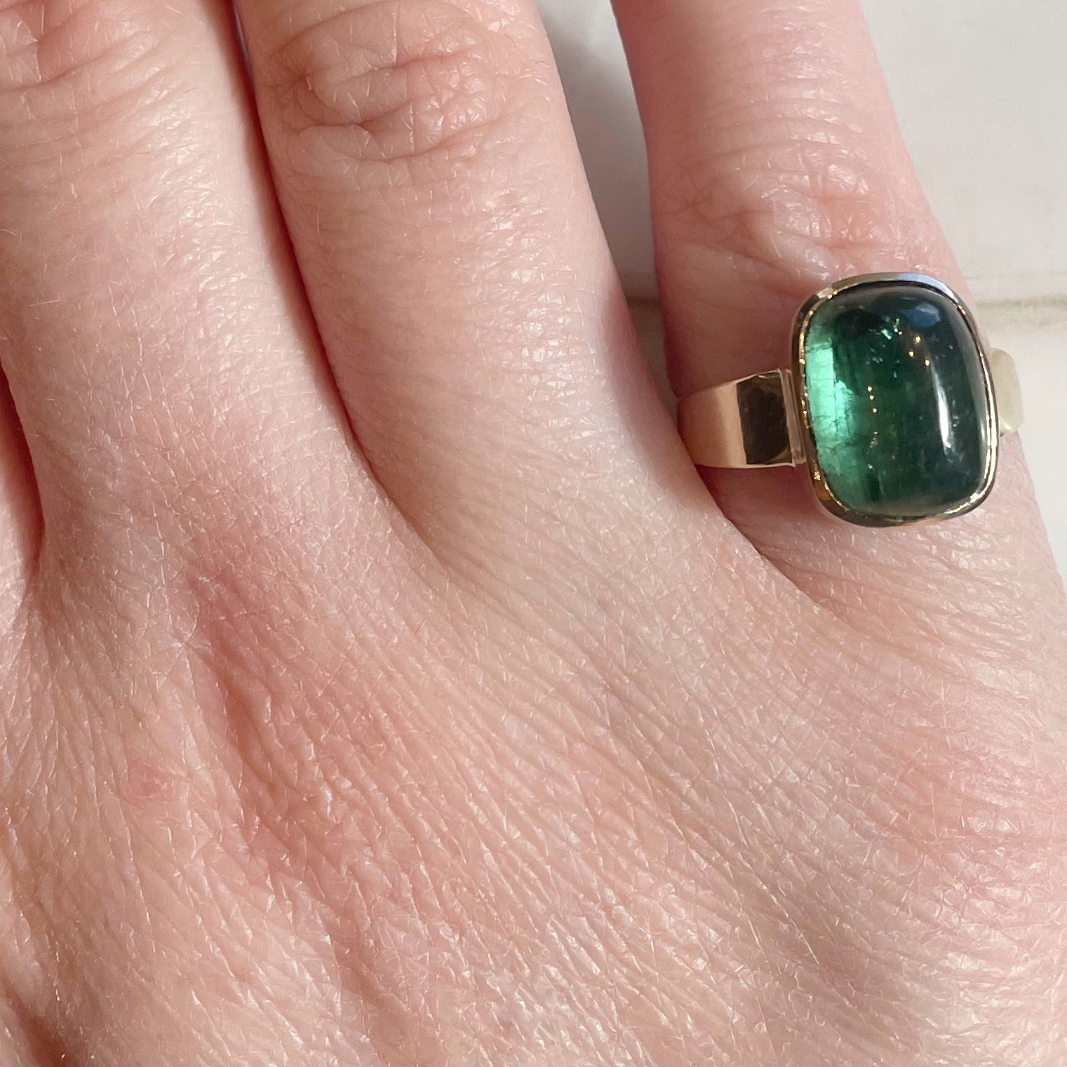 jewelry, fine jewelry, ring, green tourmaline, tourmaline, gold, 14K yellow gold, bezel, bezel setting, green, cabochon