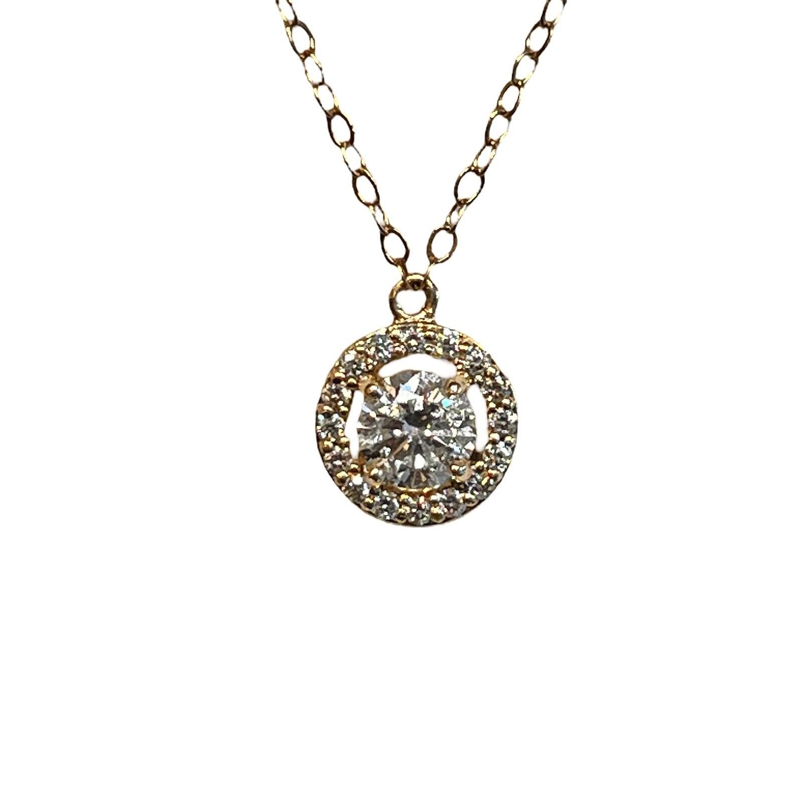 A 14k yellow gold diamond halo necklace with a round pendant design featuring a central diamond surrounded by a halo of smaller diamonds, attached to an 18-inch gold chain, antique and vintage, gold and diamond jewelry, 14k gold diamond necklace, halo diamond necklace, solid gold necklace, solid gold pendant, handmade jewelry, antique and vintage inspired, custom design