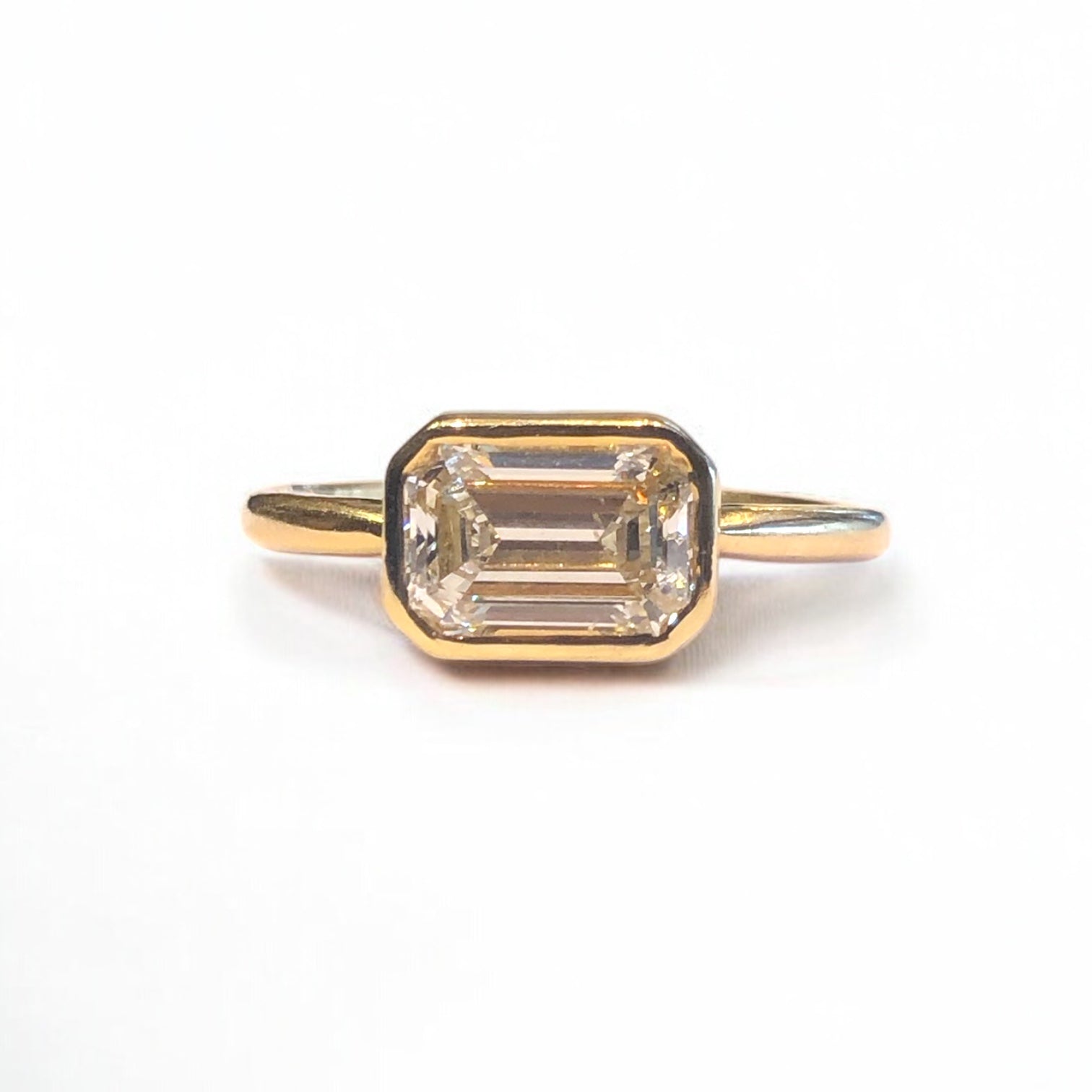 East West Bezel Set Emerald Cut Engagement Ring