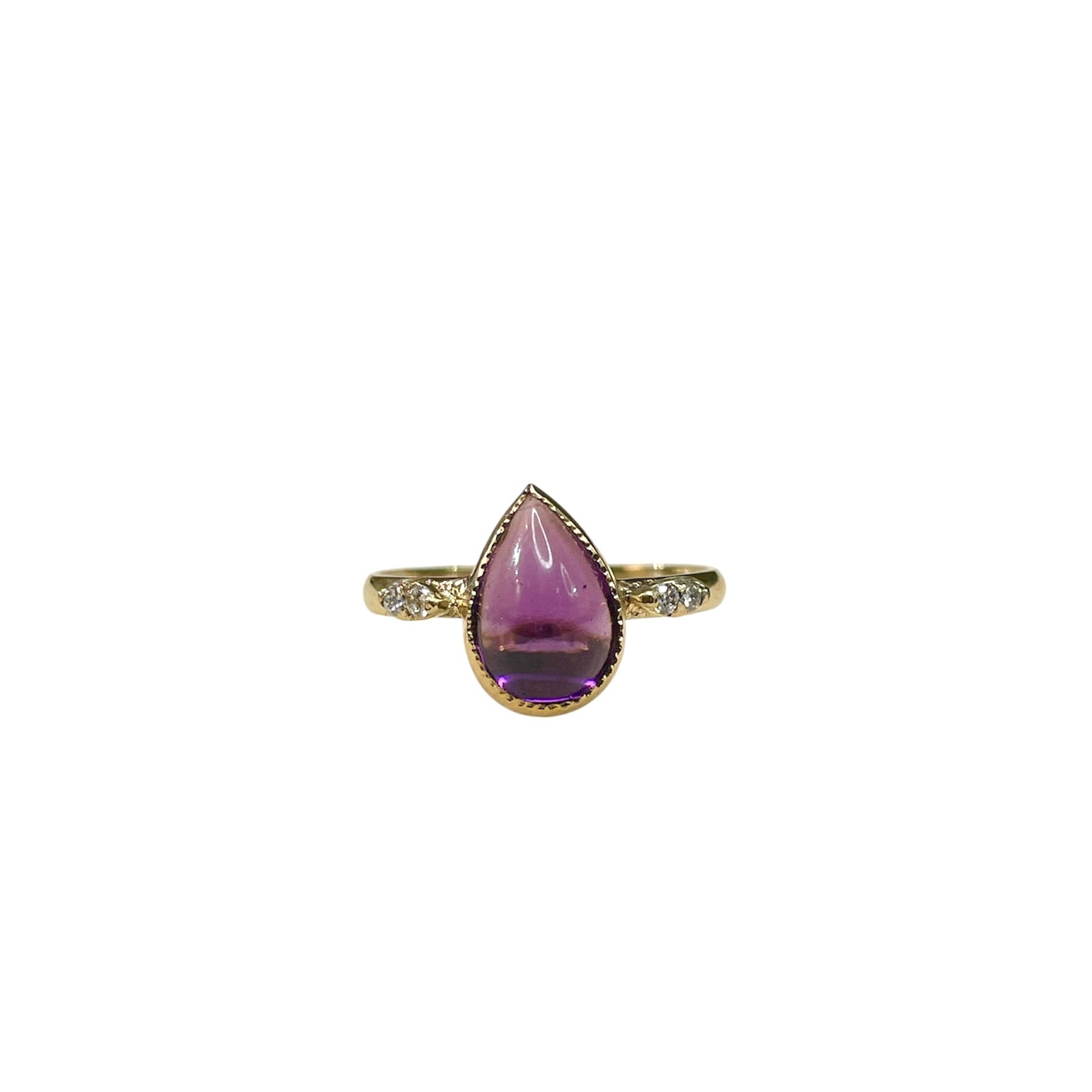 Antique ring. Pear shaped amethyst cabochon ring with four accent diamonds set into a tall shoulder setting. 14k yellow gold band and bezel with milgrain detailing.
pear, pear ring, amethyst, amethyst ring, amethyst pear shape, antique, antique ring, 14k yellow gold ring, hand restored ring, amethyst and diamond ring