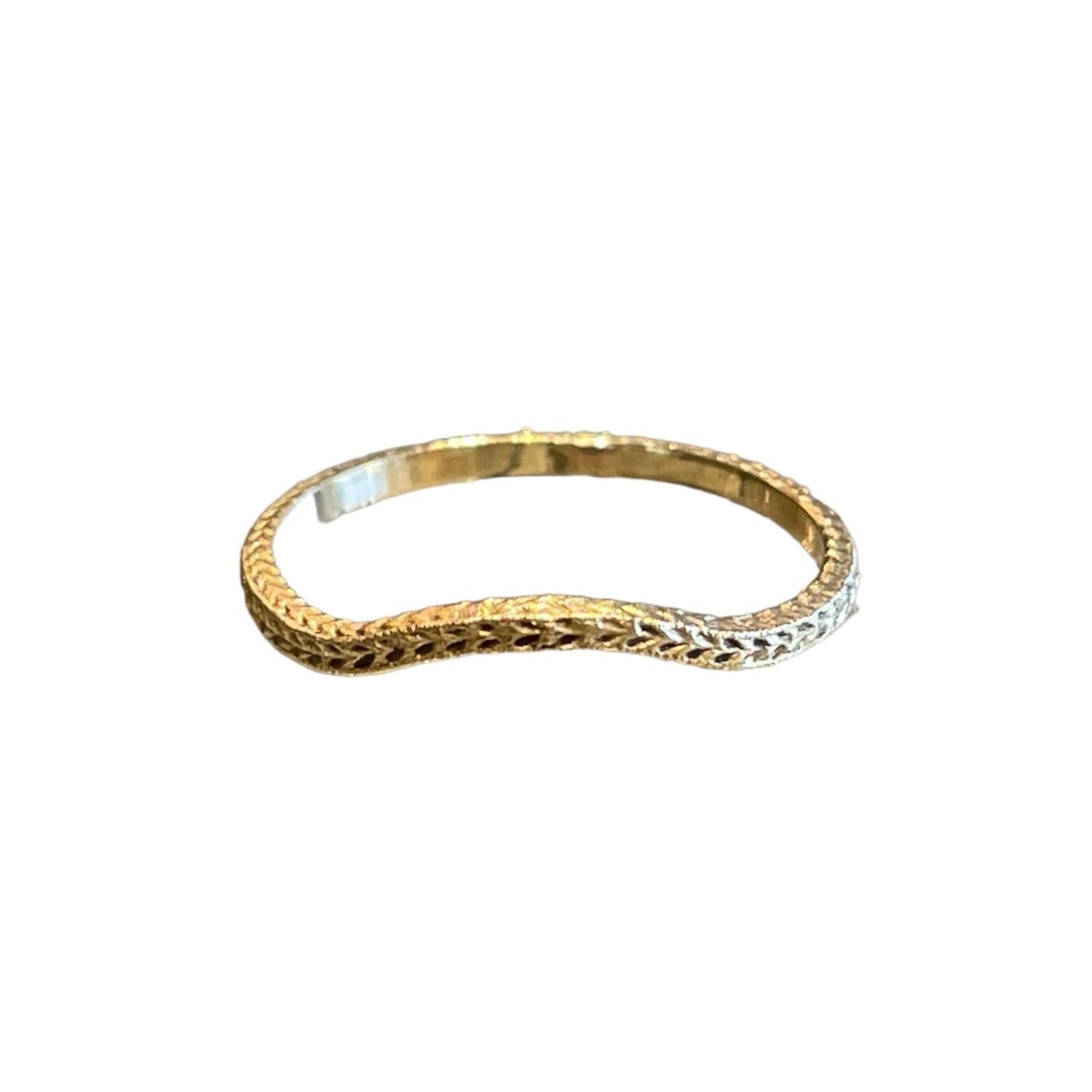 A handcrafted 14k gold ring with a wheat pattern, slightly curved to frame a lower-profile engagement ring or worn alone as a fashion ring. antique and vintage, antique casting wedding band, victorian era, art deco era, antique inspired wedding band in 14k yellow gold with a subtle curve, solid 14k yellow gold eternity engraving contour wedding band