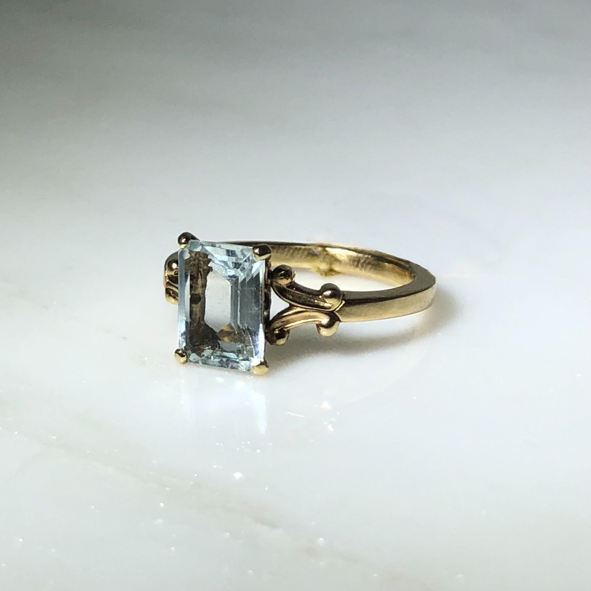 ring, gold ring, aquamarine ring, solitaire ring, aquamarine solitaire, split shank, gold and aquamarine, jewelry, 14k gold, 14k gold ring, yellow gold, emerald cut, emerald cut aquamarine, emerald cut solitaire, emerald cut ring, rebekah brooks jewelry, northampton, cambridge