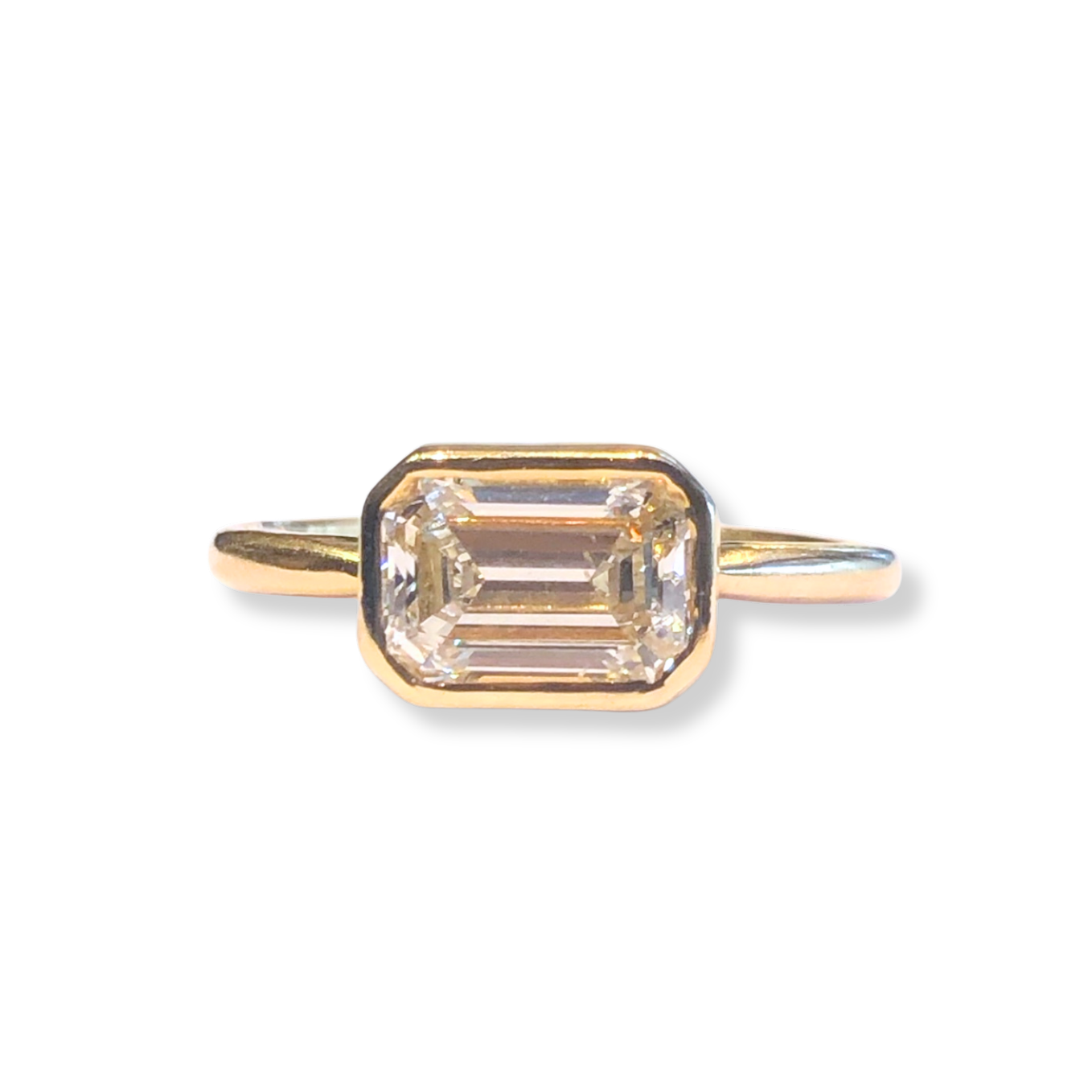 The East-West Bezel Emerald Cut Engagement Ring