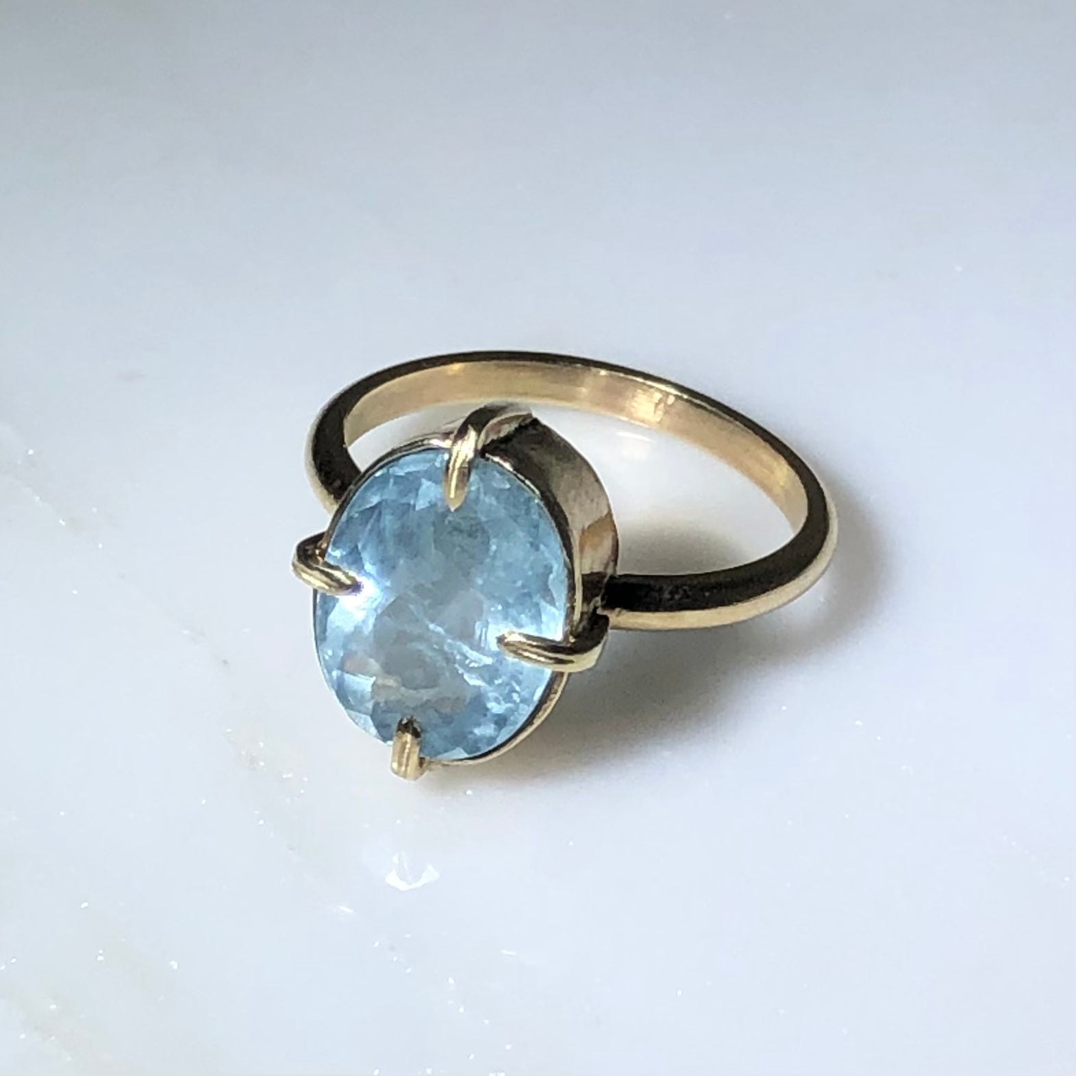 14k Oval Aquamarine Ring, axis-set 4-prong & bezel ring