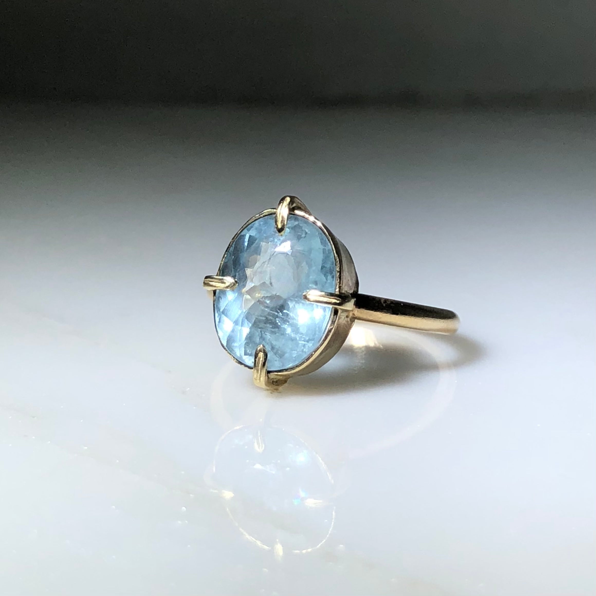14k Oval Aquamarine Ring, axis-set 4-prong & bezel ring