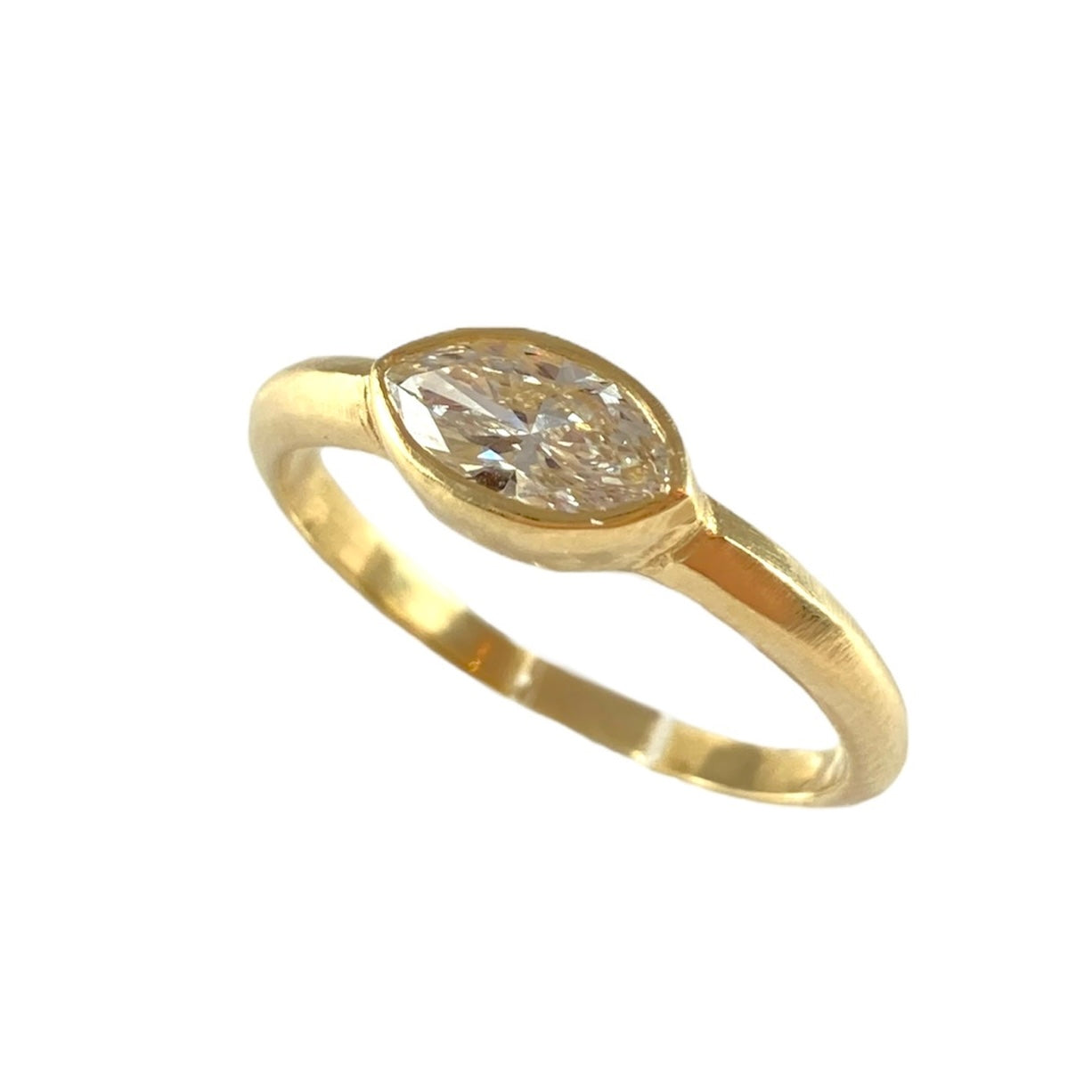 The Bezel Solitaire Engagement Ring w. Marquise Diamond