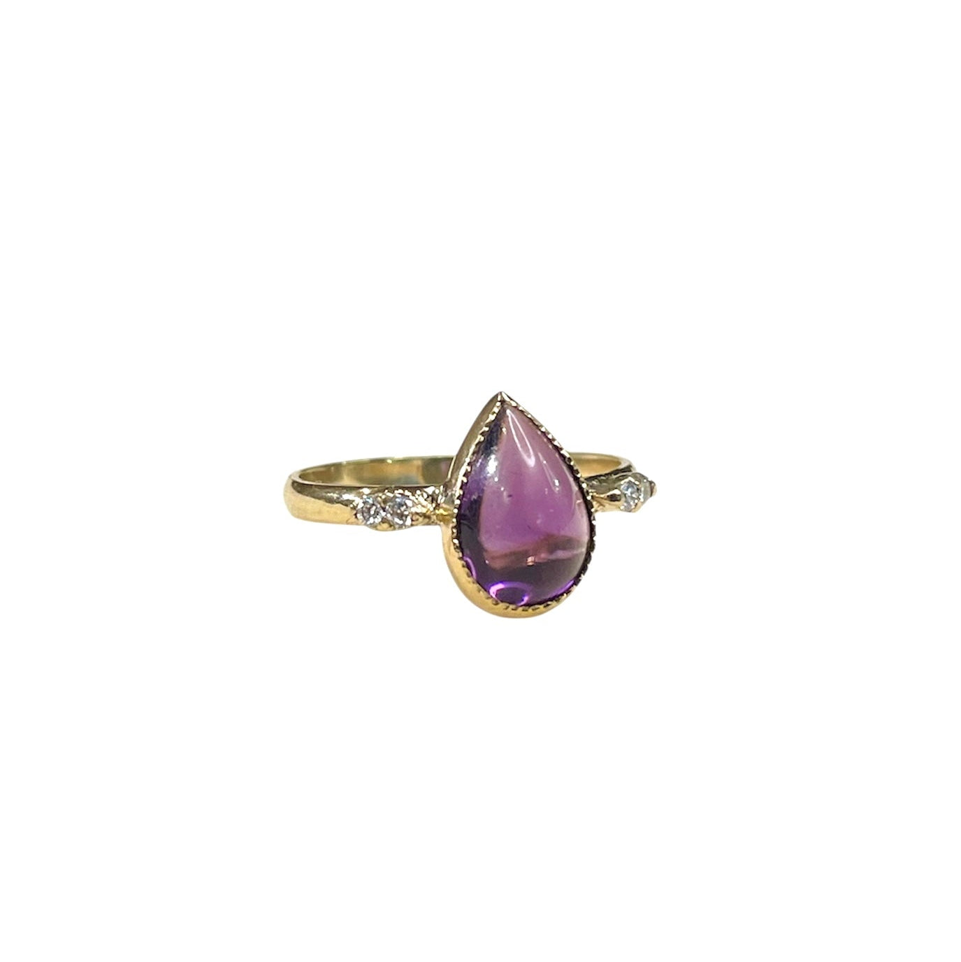 Antique ring. Pear shaped amethyst cabochon ring with four accent diamonds set into a tall shoulder setting. 14k yellow gold band and bezel with milgrain detailing.
pear, pear ring, amethyst, amethyst ring, amethyst pear shape, antique, antique ring, 14k yellow gold ring, hand restored ring, amethyst and diamond ring
