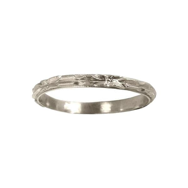 A silver-colored metal ring with a chiseled art deco era botanical pattern and milgrain detailing. art deco wedding band with intricate chisel detailing with a high shine finish it is 2mm in width 